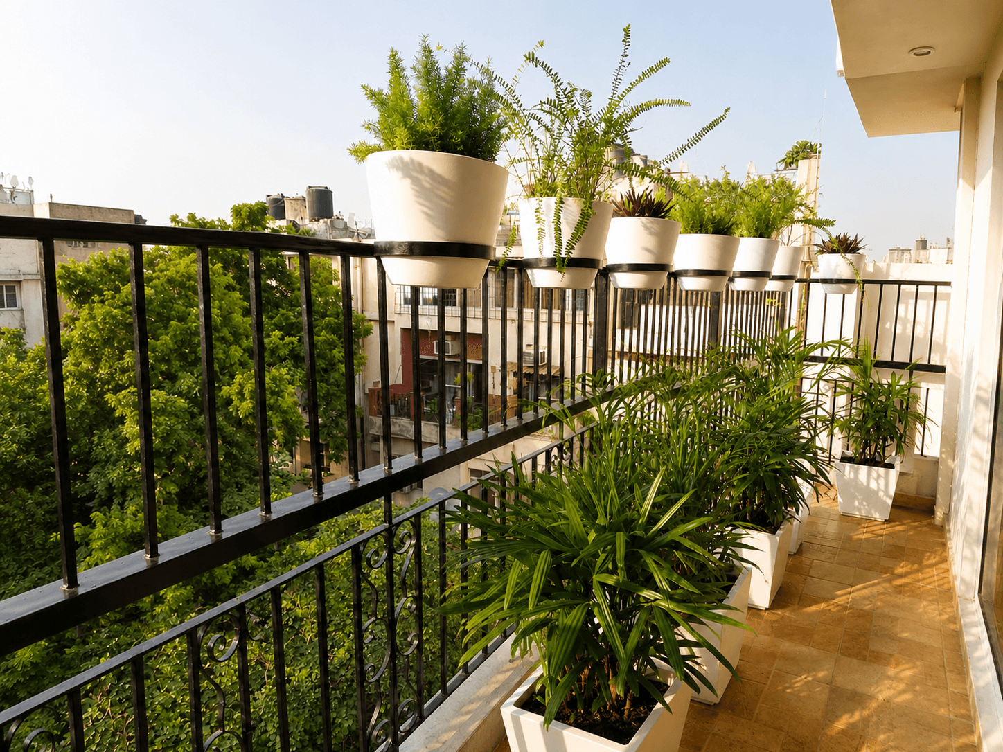 Greenish balcony makeover with layered plants and railing planters